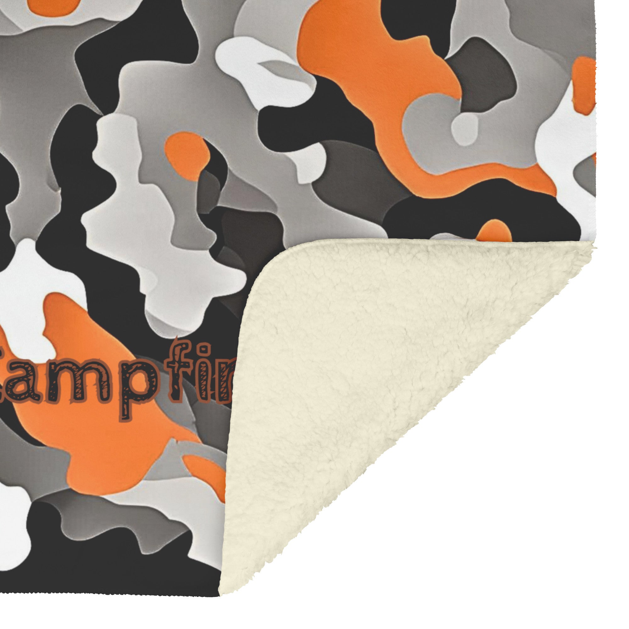 Cozy black, orange and white camo sherpa fleece blanket – semi-weighted for extra comfort and anxiety relief, perfect for cold nights or snuggling in. With corner flipped up showing the fleece side.