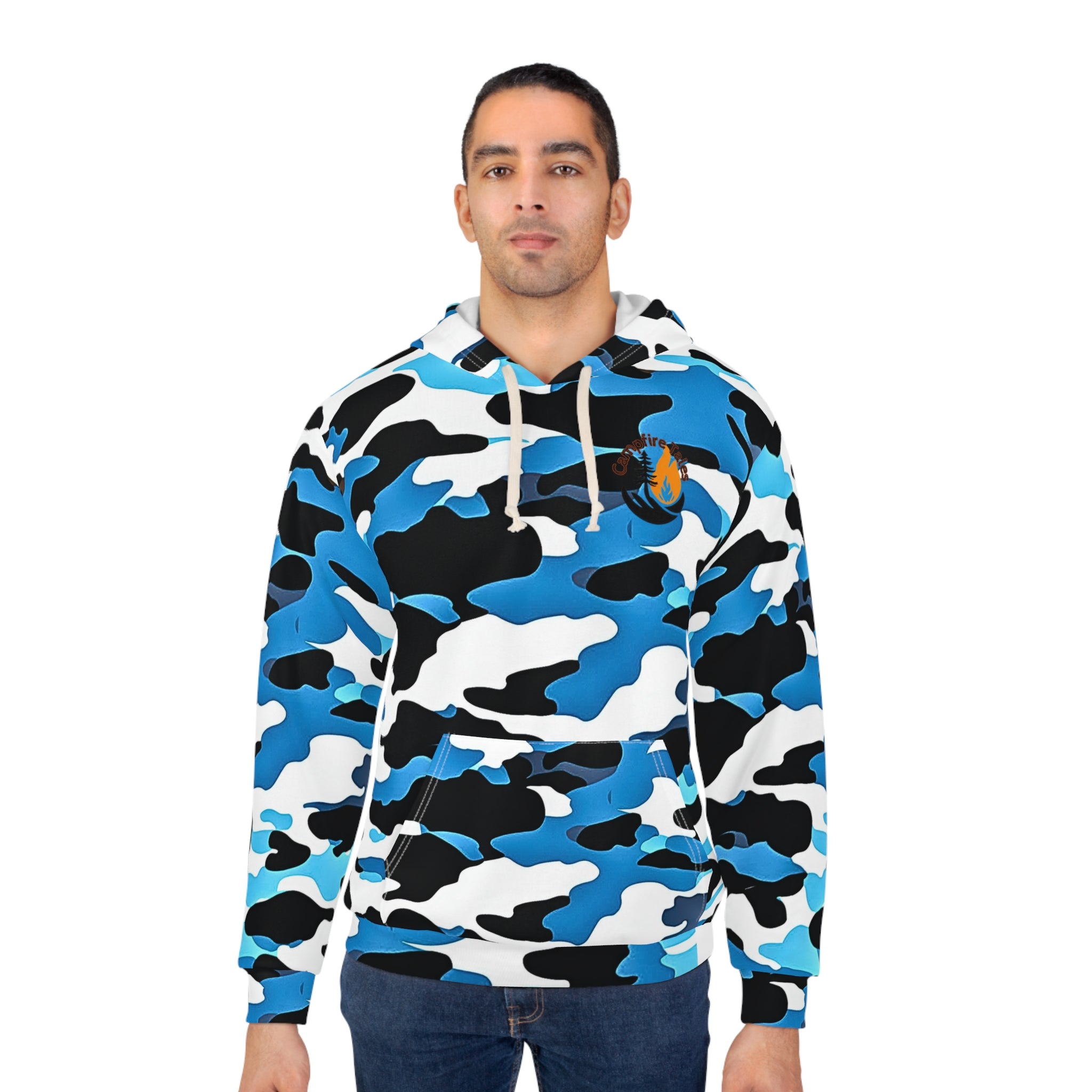 A man stands against a plain white backdrop, wearing Printifys Unisex Blue Camo Resilience Hoodie in blue, black, and white camo. This polyester hoodie features a seamless design with an orange chest emblem, highlighting its sleek look.